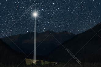 The moon shines over the manger of christmas of Jesus Christ