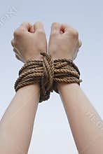 Tied with rope hands