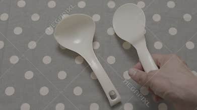 Laying out plastic utensils for rice and soups