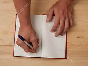 The author signs an autograph