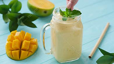 Mango smoothie in glass jar