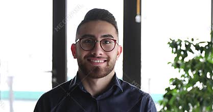 Happy arab businessman team leader looking at camera.