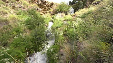 Crystal clear water flowing down the mountain