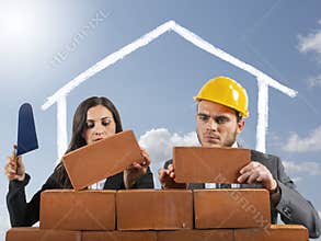 Couple works like masons to build a house to have a family