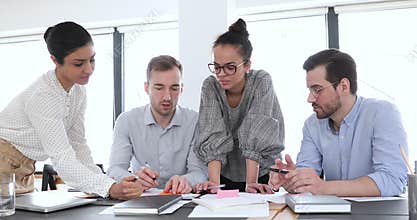 Multi ethnic company workers group brainstorm at office meeting table