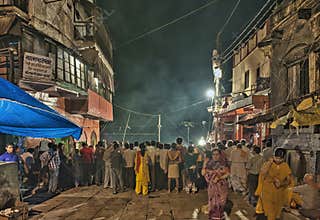 People gathered for religious Ganga Aarti ceremony or fire puja at Dashashwamedh Ghat in Varanasi