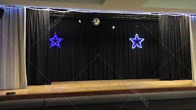 Empty stage with two glowing stares