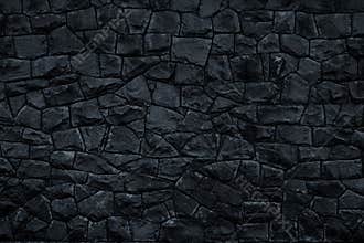 Dark stone background. Black rock wall texture. Abstract pattern. Natural backdrop. Decoration gray tiles at the facade of the bui