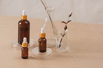Cosmetic bottle stock images. Brown cosmetic bottle with batcher. Vials on a white background