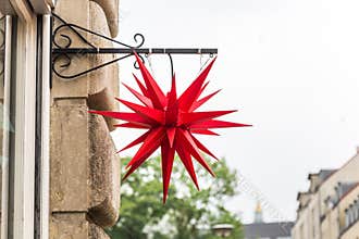 A 3D red star logo of a shop in Berlin, Germany