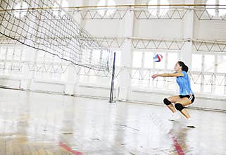 Girls playing volleyball indoor game
