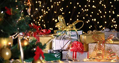 Christmas gifts near Christmas tree and atmospheric lights