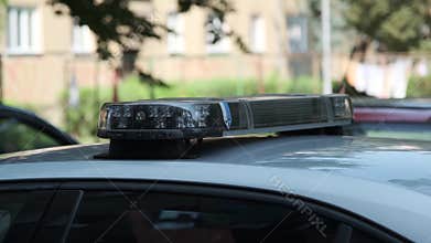 Detail of a flashing blue siren on a Czech police car in an emergency situation