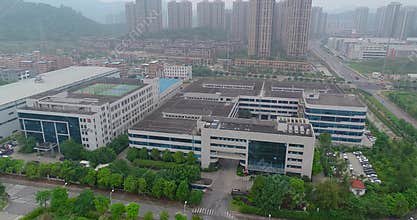Large factory aerial view, exterior of a modern factory. Factory, residential area in the background