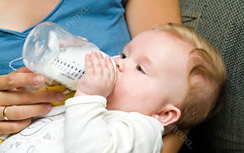 Baby eating from bottle