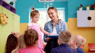Children and teacher in the preschool