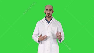 Arabian Doctor Talking to Camera on a Green Screen, Chroma Key.