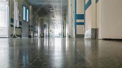 Medical staff at clinic's hallway. Timelapse