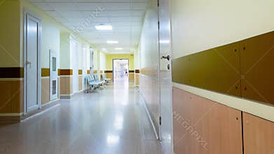 Medical staff at clinic's hallway.