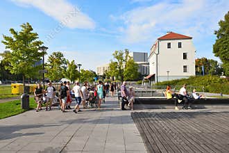 People relaxing on Mill Mlynska Island in the historic district of Bydgoszcz