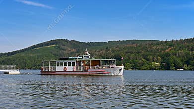 Cruise ship / steamer on the Brno dam. Beautiful summer sunny during recreation - vacation near water.