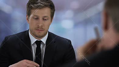 Unsure job applicant suffering stress during interview looking company manager