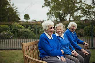 Senior Women Laughing on a Bench