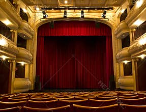 Old theater stage and red curtain
