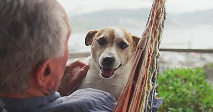 Senior man and his dog at home