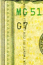 Plastic security strip inside 20 USD banknote. Security strip on American banknote created to prevent counterfeiters