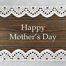 Happy Mothers Day card with lace borders on wooden background