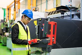 Factory manager use computer for productivity