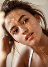 Portrait of a model on a sunny day shadows fall on the face and create a beautiful picture