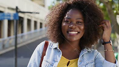 Curvy happy black woman looking at camera