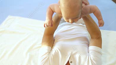 Dad does fitness with the baby at home