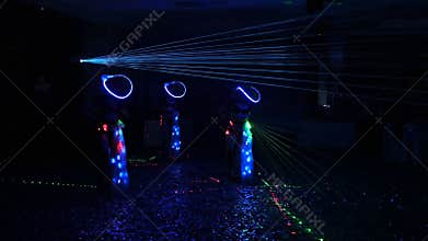 Dancer in a night club. shoes and fishnet legs women dance in a nightclub. Bright color music at discos