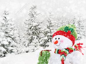 Happy snowman in winter landscape