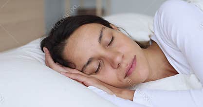 Serene calm young mixed race woman sleeping well.