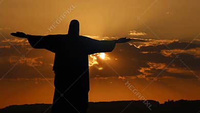 Jesus Christ redeemer statue silhouette in Rio de Janeiro Brazil sunrise sunset sky timelapse