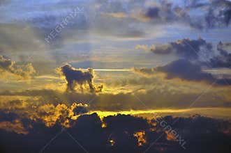 Beautiful sunset with bright red clouds and sunbeams. Abstraction