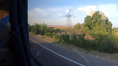 Window view of a moving bus