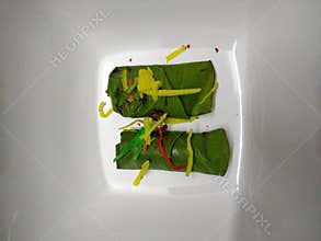 Two Indian paan betel leaves stuffed up with mouth fresher properties ingredient