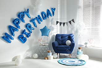 Phrase HAPPY BIRTHDAY made of balloon letters in decorated room