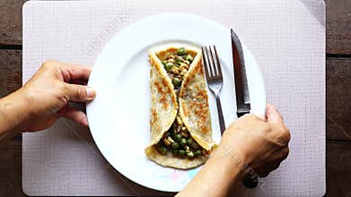 Fried Roti or Chapati with minced pork and green pea for breakfast.