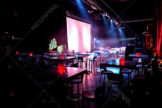 Empty Dark and Moody Night Club room with chairs and tables