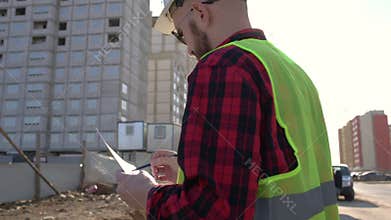 Civil engineer checking work for communication to management team in the construction site