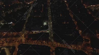 AERIAL: Barcelona Overhead Drone Shot of Typical City Blocks at Night with Beautiful City Traffic lights