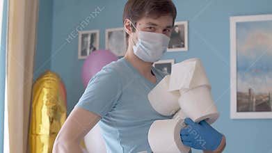 Funny man holding many rolls of toilet paper