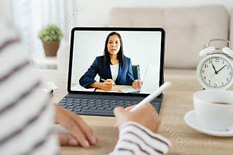 Shoulder view. hand of Asian women Video Conference online with leadership On the tablet, Businesswoman work from home