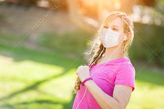 Cautious Girl Wearing Medical Face Mask During Workout Outdoors